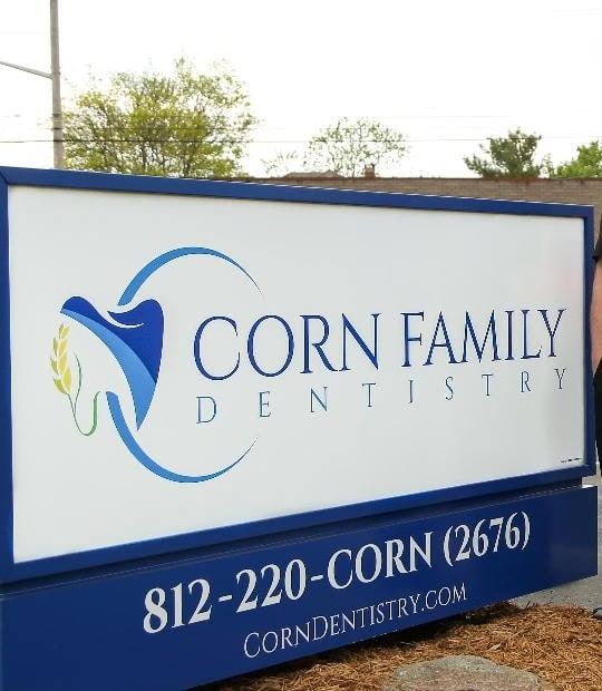 The Corn Family Dentistry sign outside our Edinburgh office, with the number 812-220-CORN (2676)
